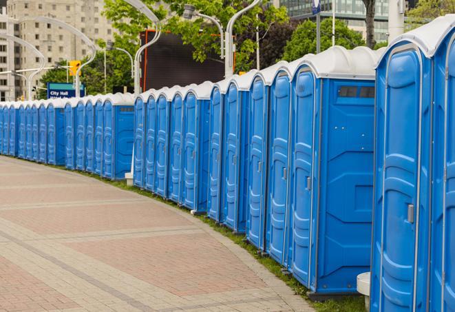 a row of portable restrooms at a fairground, offering visitors a clean and hassle-free experience in alta